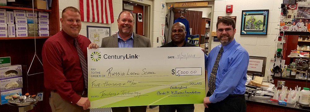 CenturyLink providing a check to Russia Local School Principal, Brian Hogan